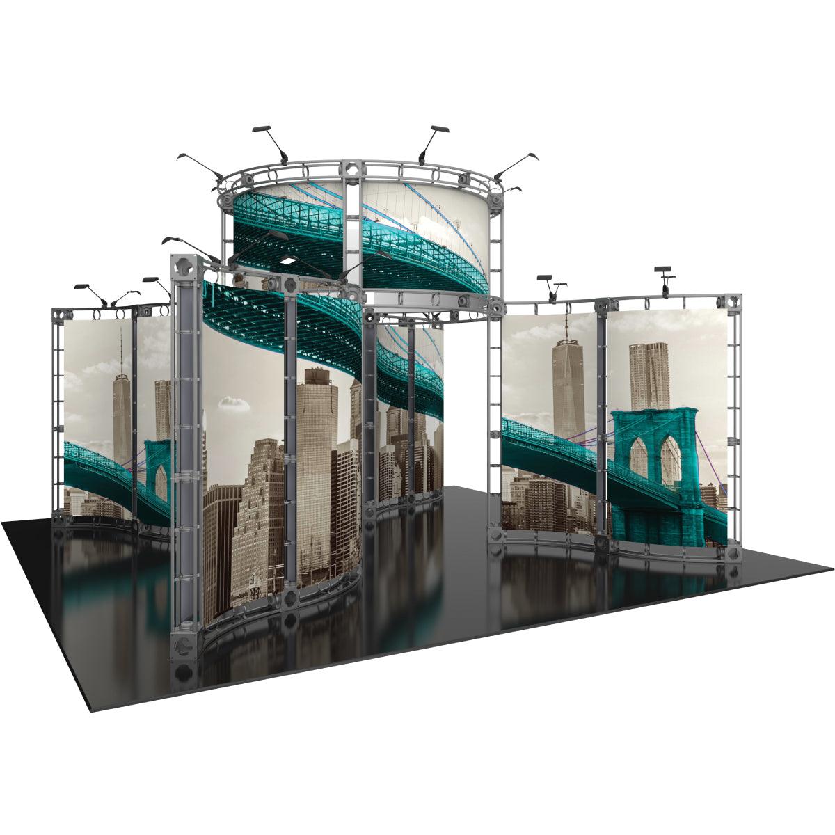 Trade show display with curved truss frames showcasing cityscape graphics and overhead lighting