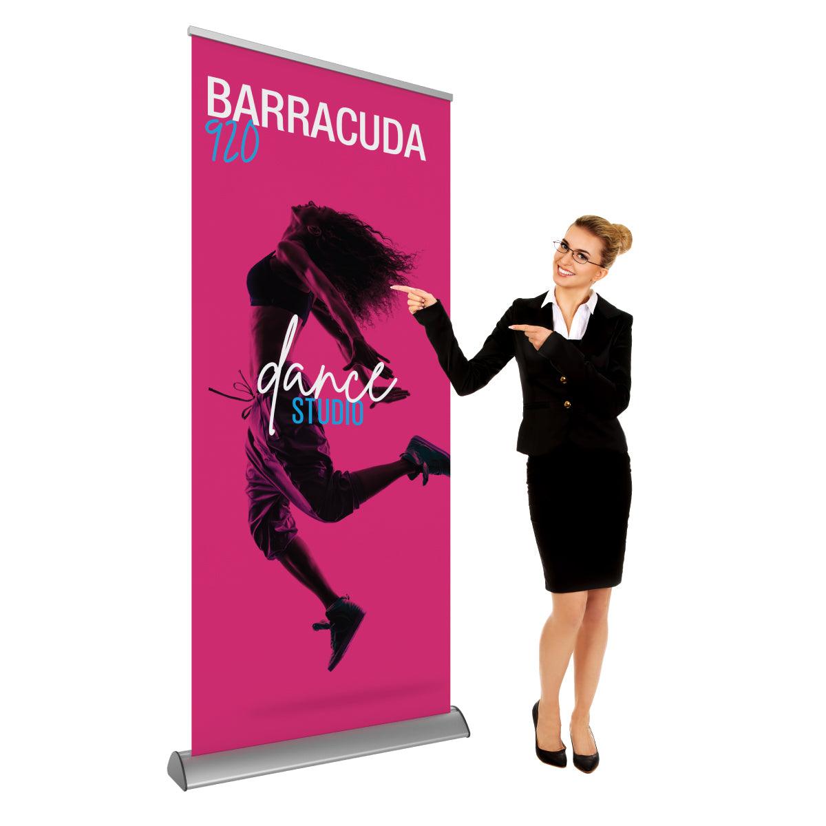 Retractable banner stand for trade shows featuring dynamic dance studio advertisement with businesswoman pointing
