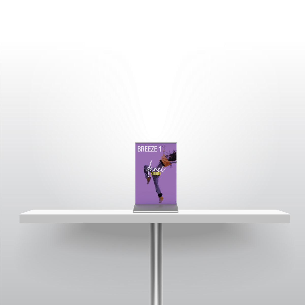 Tabletop banner stand on table showcasing dance studio promotion for trade shows and events