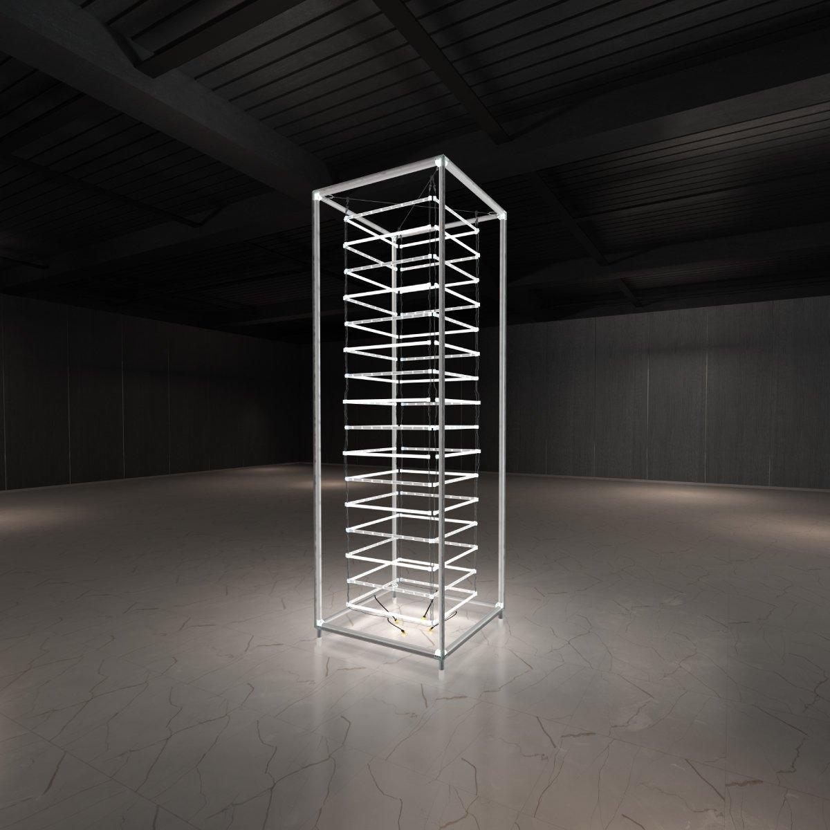Tall illuminated modular tower structure for trade shows and exhibitions in an empty event space