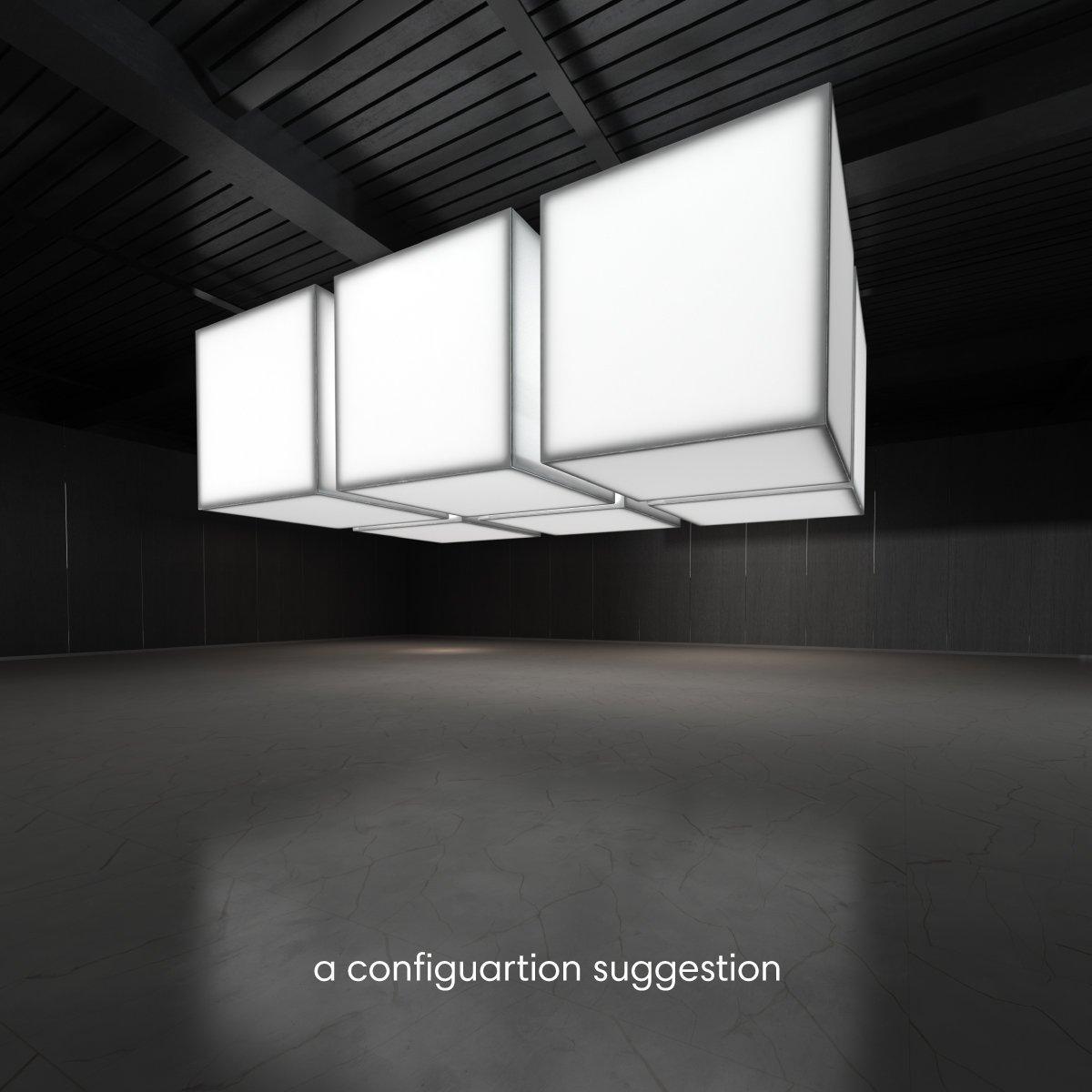 Hanging lightbox cube display setup for trade shows and exhibitions in an empty event space