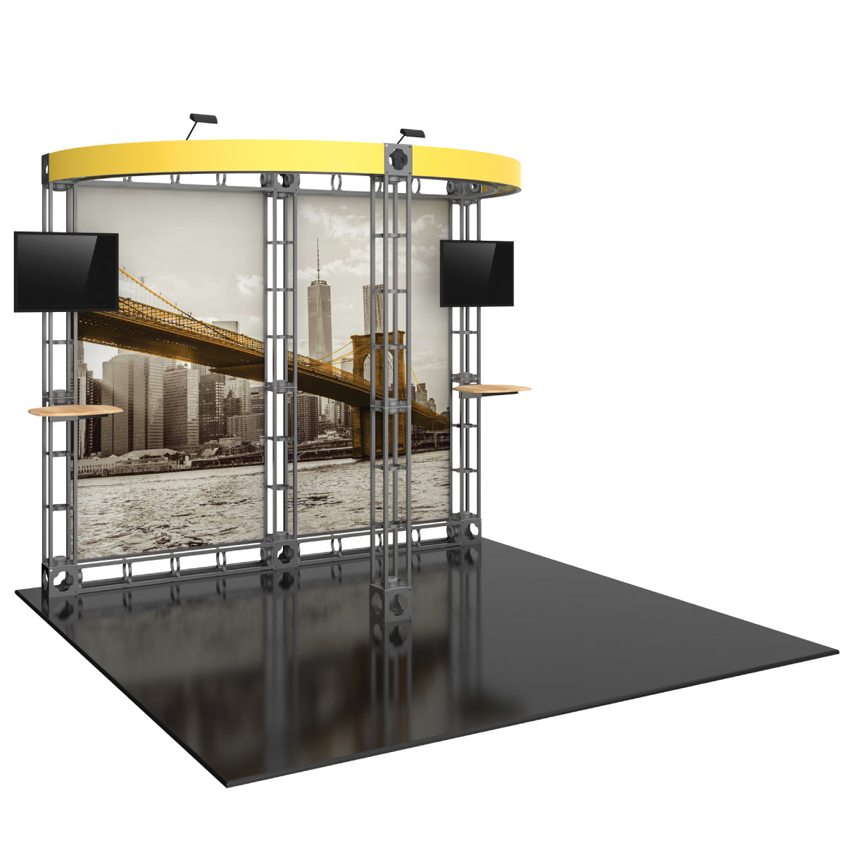 Trade show display with truss frame, large cityscape backdrop, two mounted monitors, and small shelves