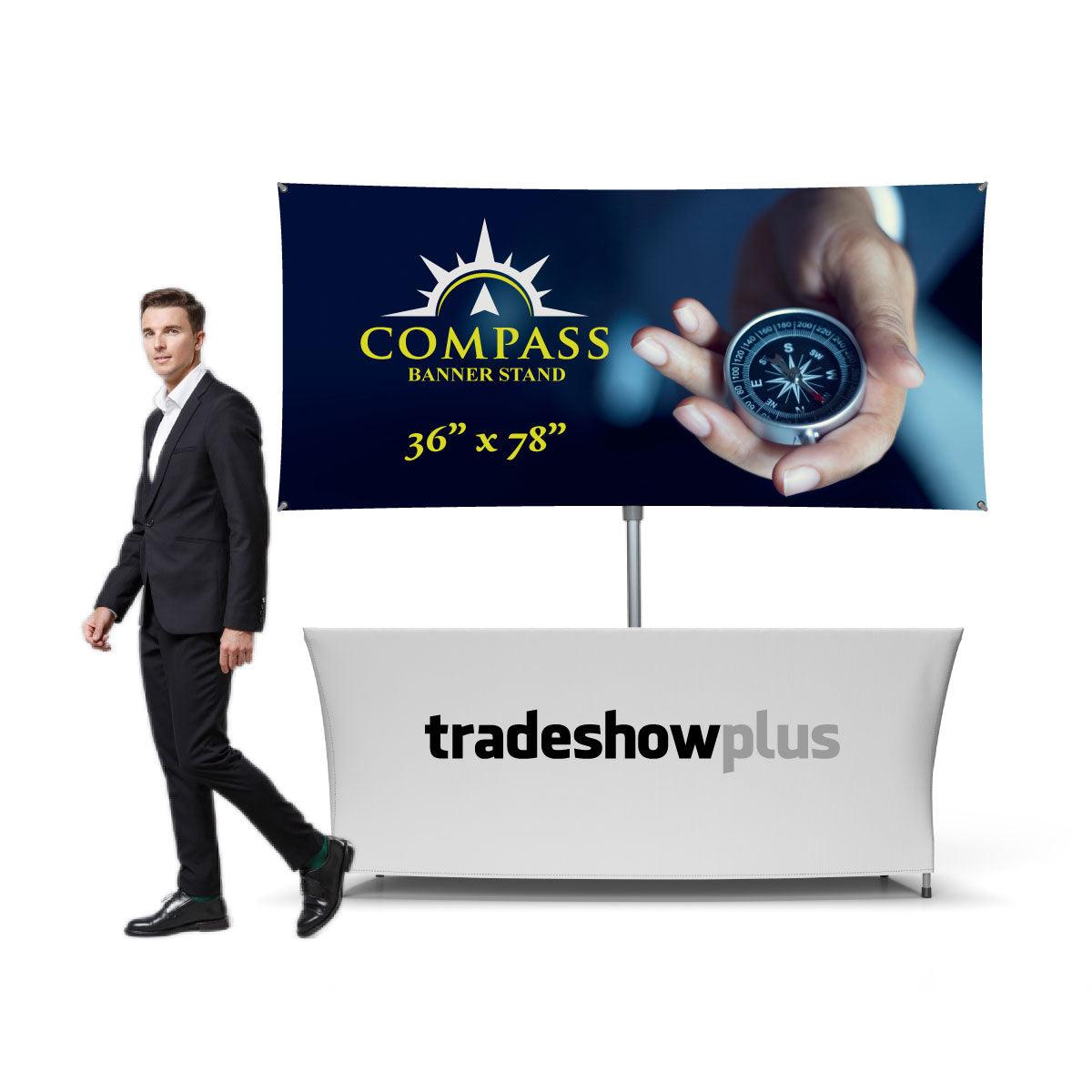 Trade show booth setup with Compass banner stand and tradeshowplus branded table cover for exhibitions
