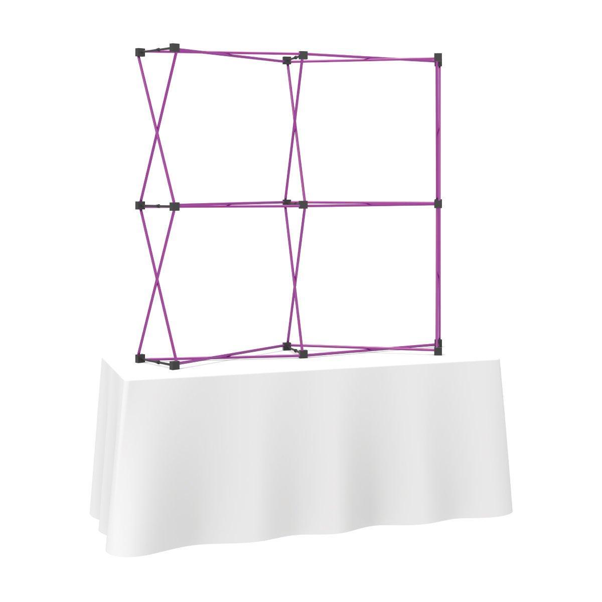 Curved fabric tabletop display frame on covered table for trade shows and exhibitions