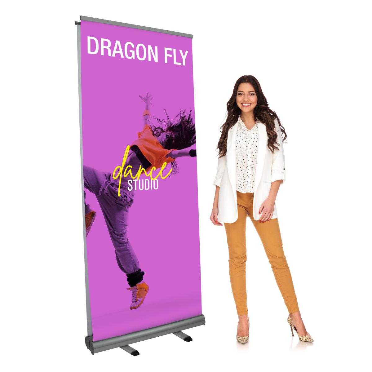 Trade show retractable banner stand featuring dynamic dance studio graphics with model demonstration