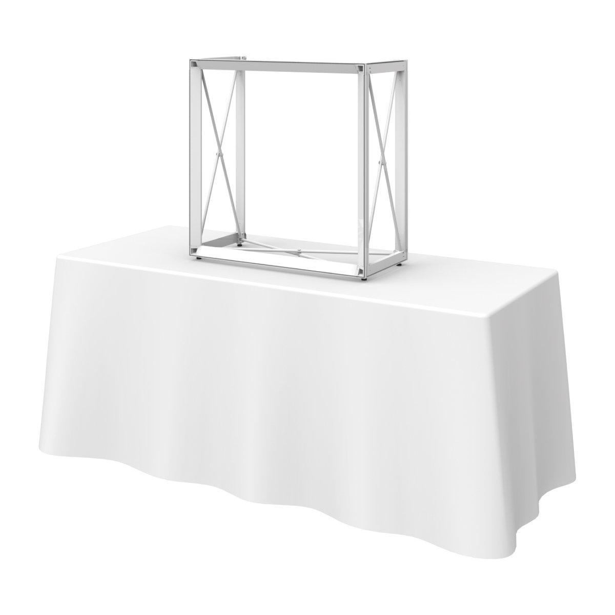 Modular frame structure on a table draped with cloth for trade show or exhibition display