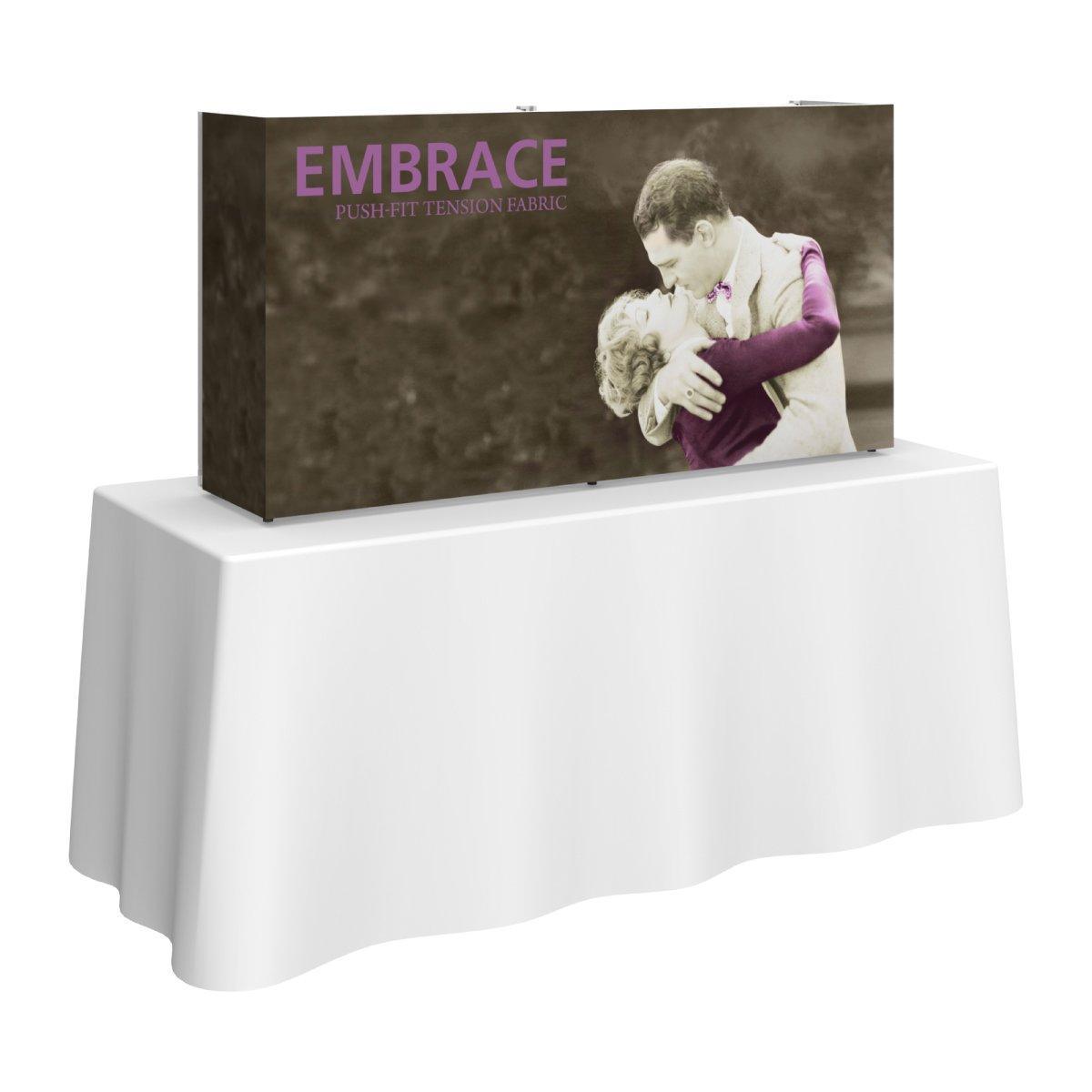 5ft tabletop display with tension fabric wrap showing a romantic embrace for trade show and event branding