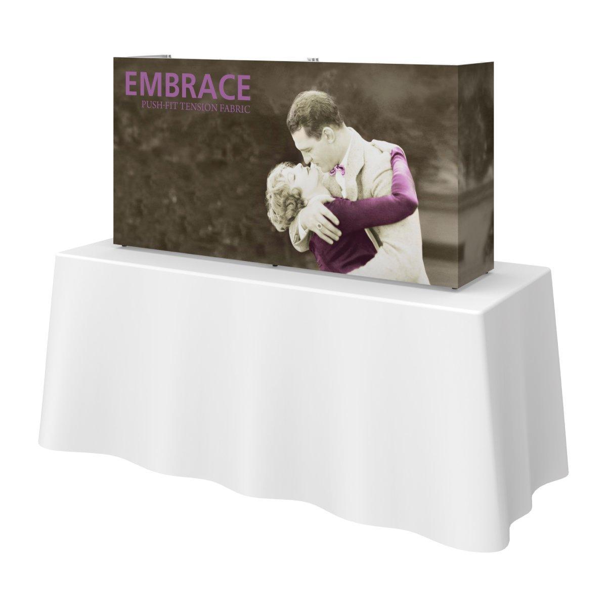 Compact tabletop trade show display with printed fabric featuring vintage romantic embrace image