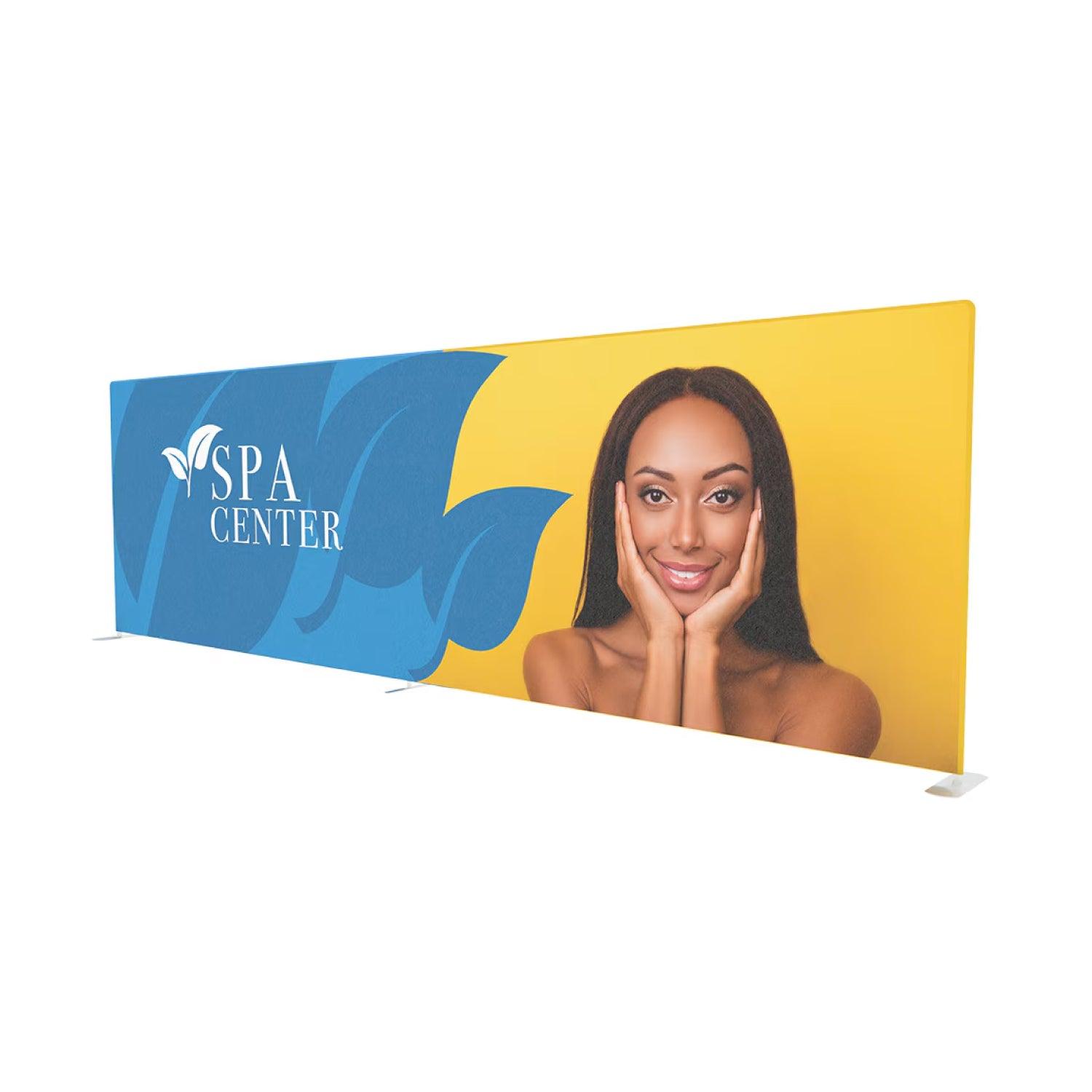 Large fabric trade show display featuring spa center branding and woman portrait for exhibitions