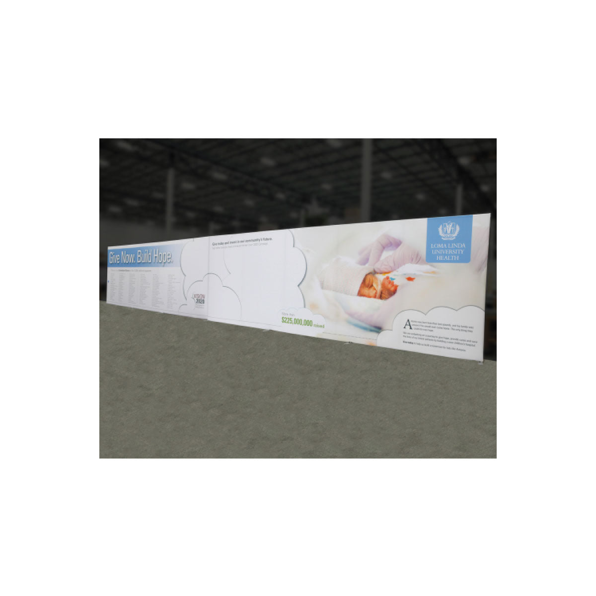 Large trade show exhibit banner featuring Loma Linda University Health promoting community donation and care for premature infants