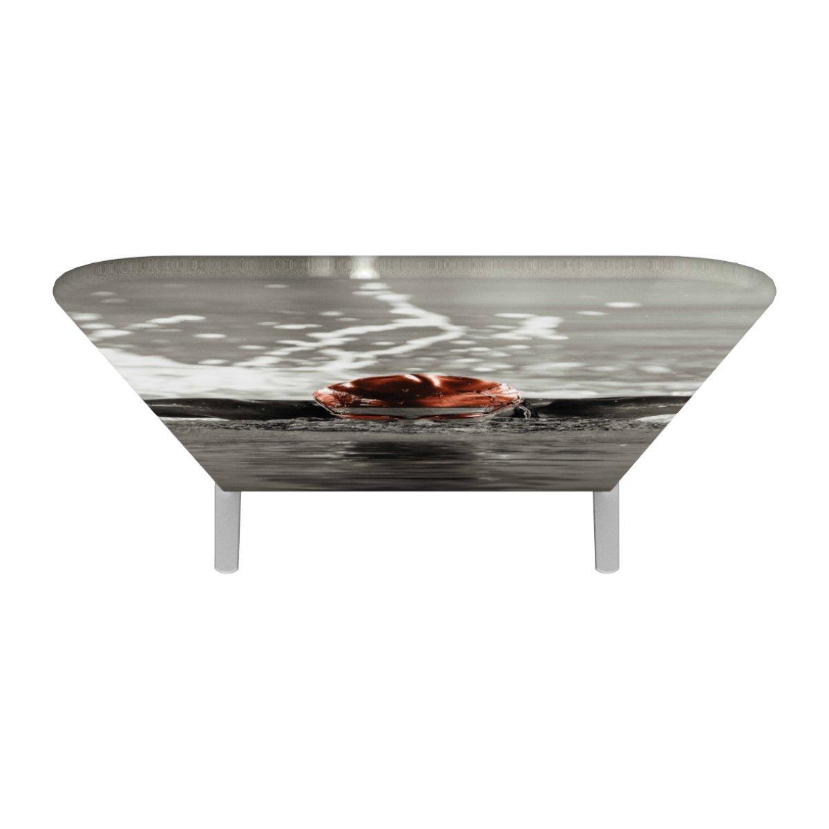 Trade show table with custom printed fabric graphic featuring water and circular object for exhibitions and events