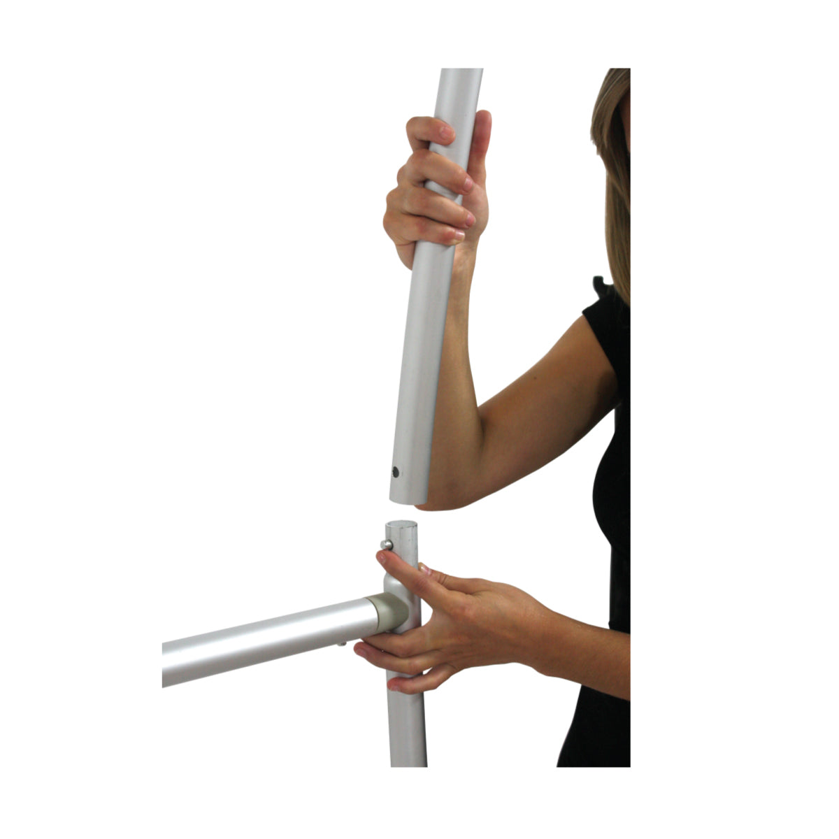 Hands assembling welded frame tubing for trade show display or exhibition stand