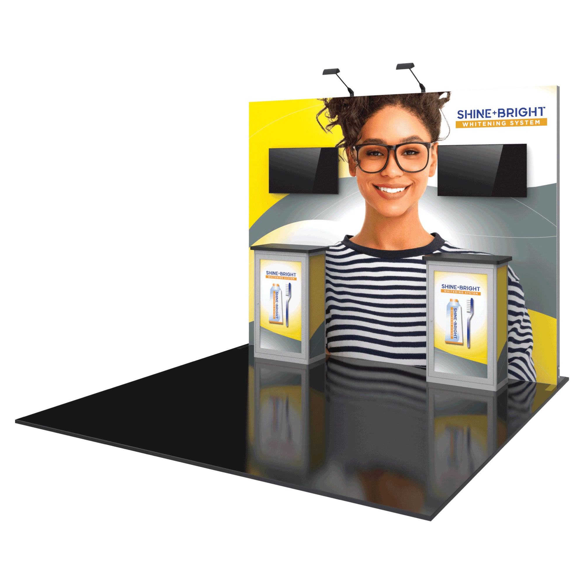 Trade show display with large backdrop featuring a smiling woman and product branding, modular counters, and dual monitors