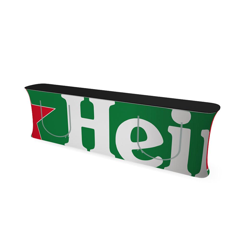 Trade show counter with branded stretch fabric cover and black tabletop for exhibitions and events