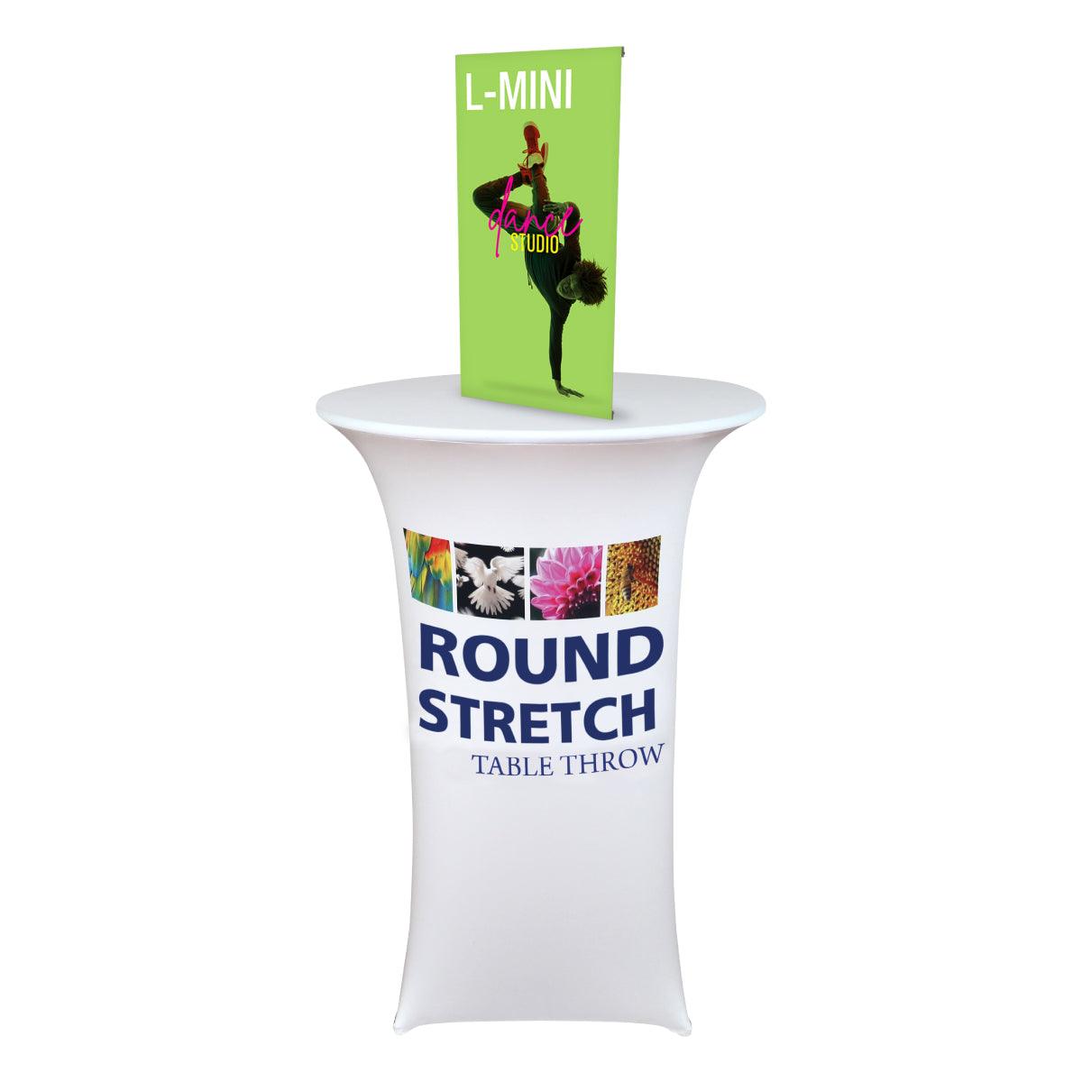 Round stretch table throw with tabletop banner stand displaying dance studio graphics for trade shows and events