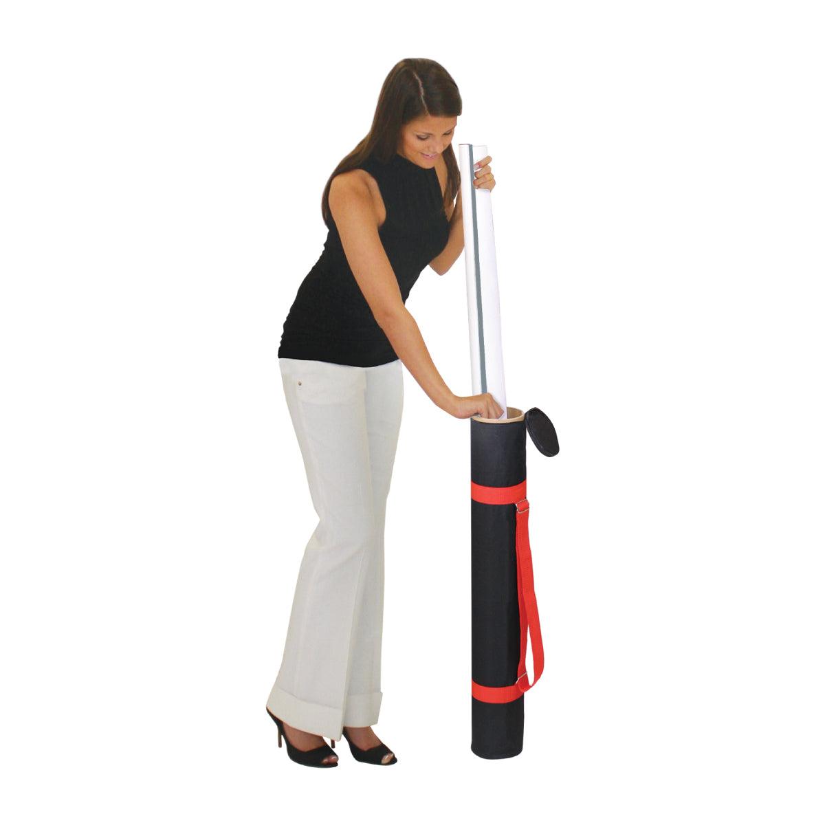 Woman placing rolled trade show banner into portable carrying case with shoulder strap for exhibitions