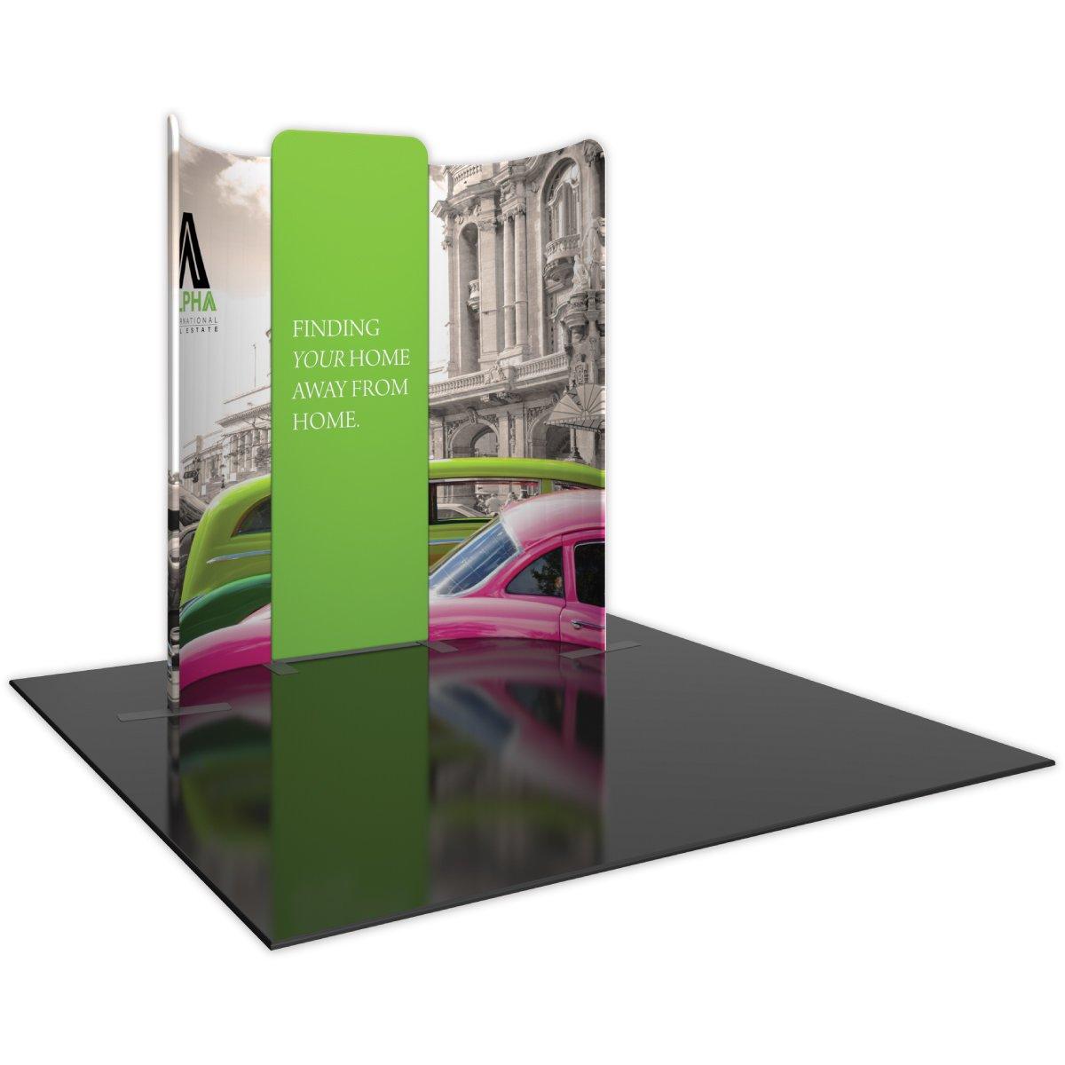 Trade show display kit featuring curved backdrop with vintage cars and real estate messaging for exhibitions