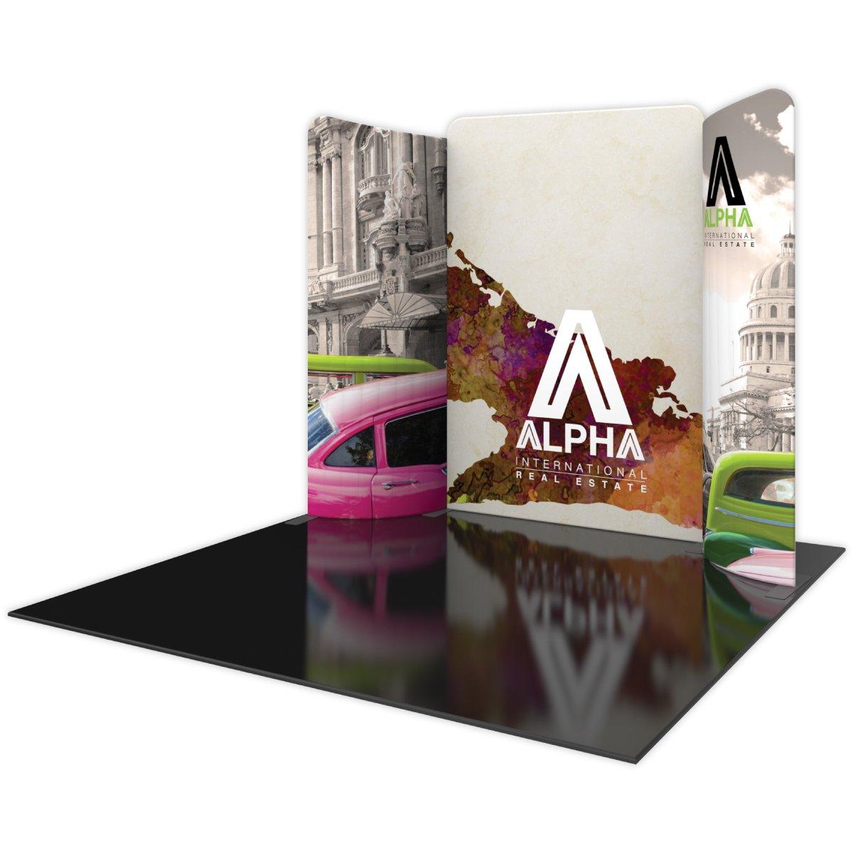 Trade show display kit featuring curved backdrop with international real estate branding and urban architecture graphics