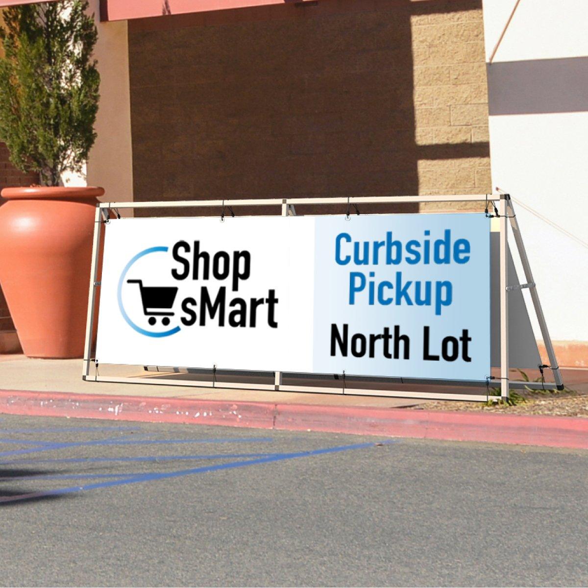 Trade show banner stand displaying curbside pickup signage for Shop Smart at outdoor event