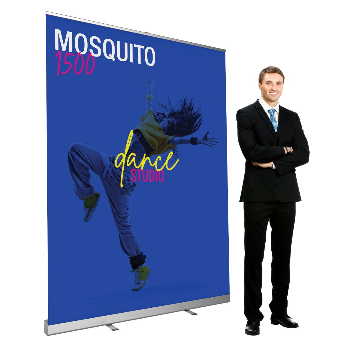 Retractable banner stand with dance studio graphic displayed next to a man in business suit for trade shows