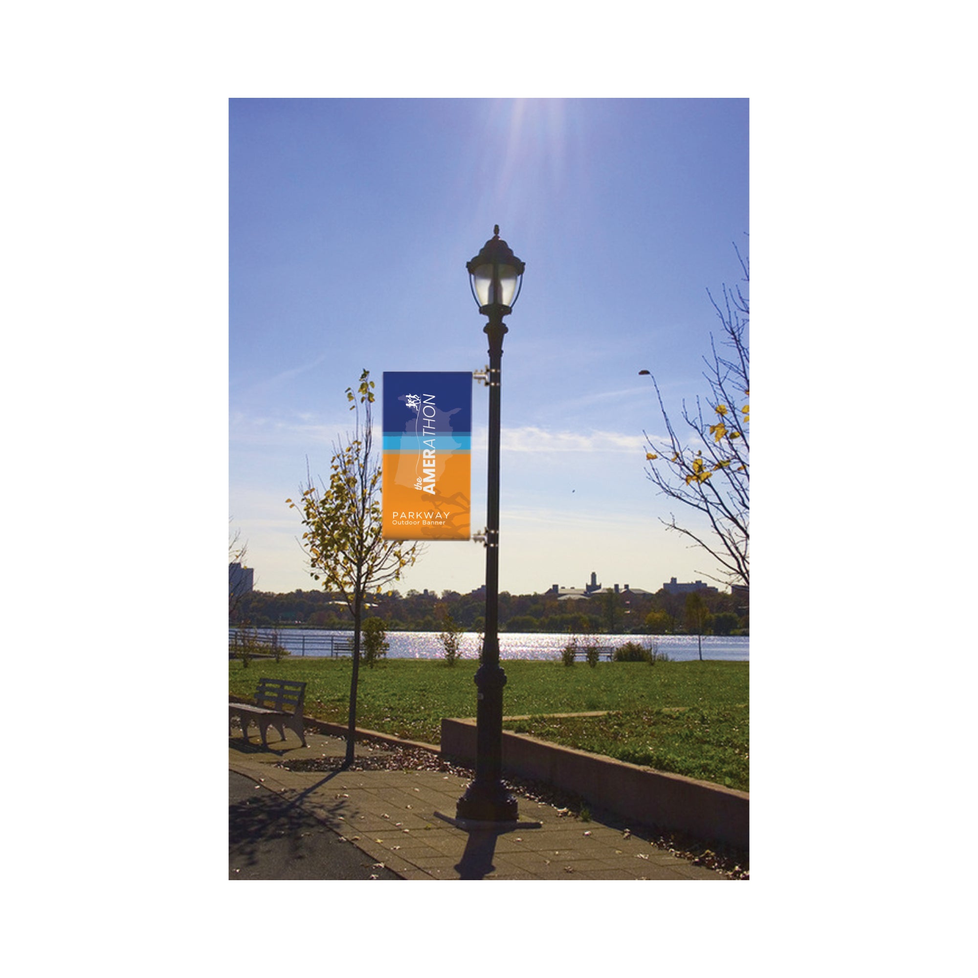 Outdoor banner mounted on street lamp in park setting for trade shows and special events