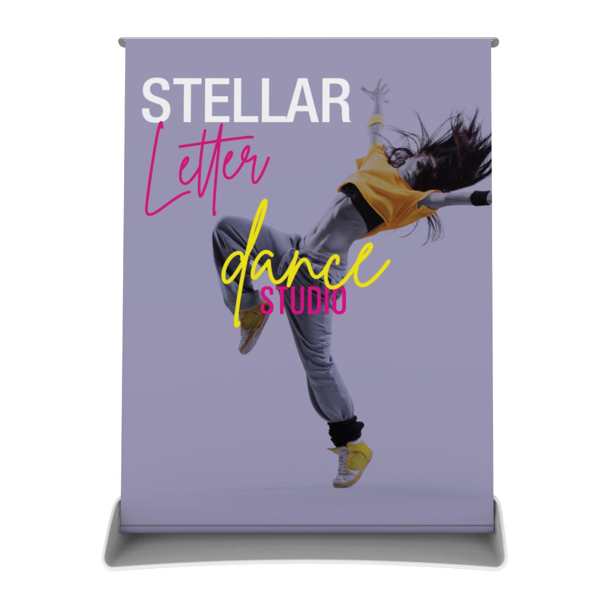Retractable tabletop banner stand with dynamic dance studio advertisement for trade shows and events