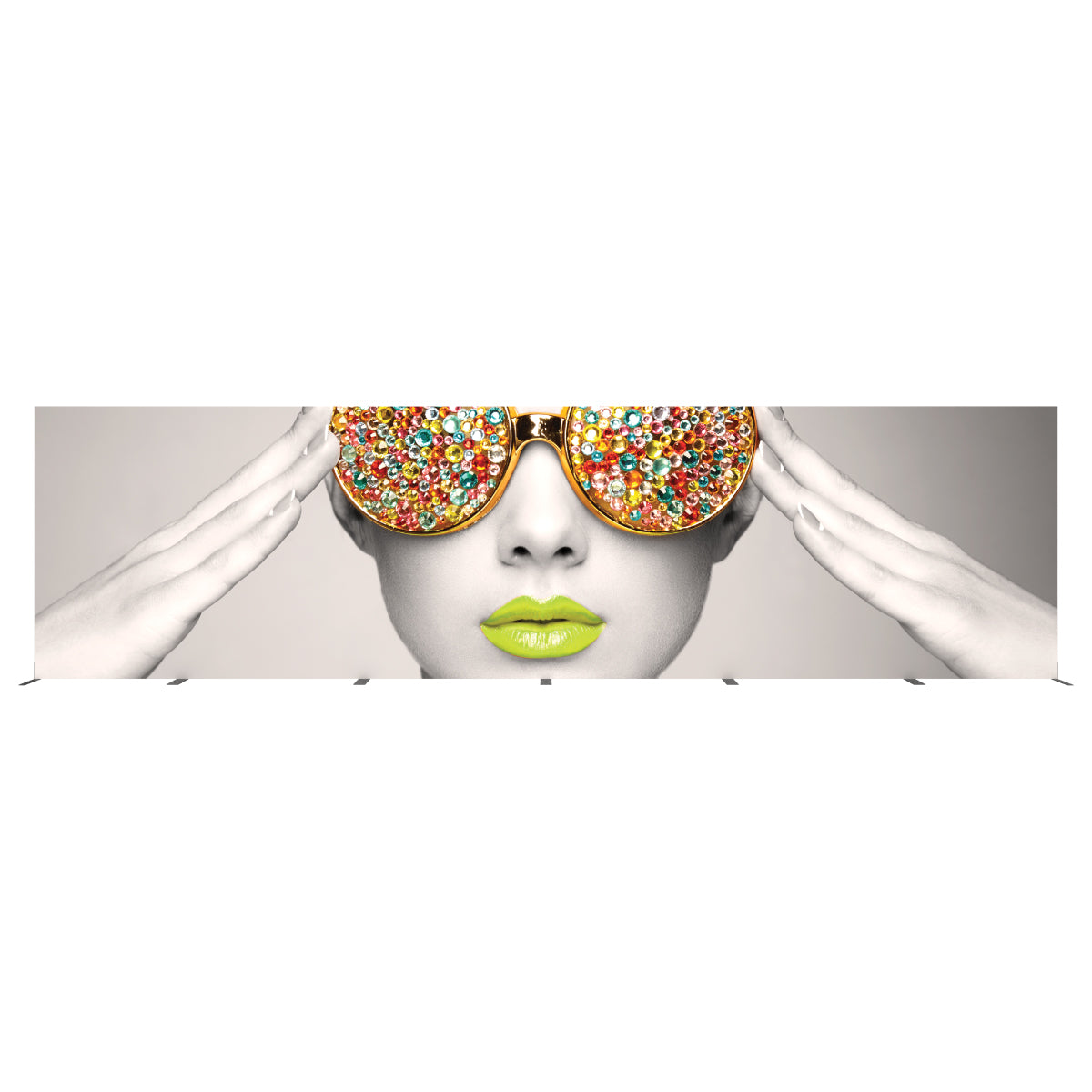 Trade show display featuring close-up of face with decorative oversized sunglasses and vibrant lips artwork