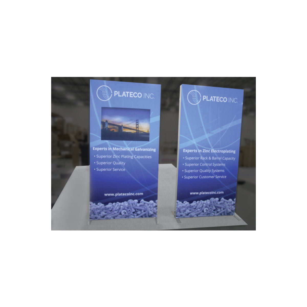 Two freestanding trade show banners for Plateco Inc. showcasing zinc plating and electroplating services