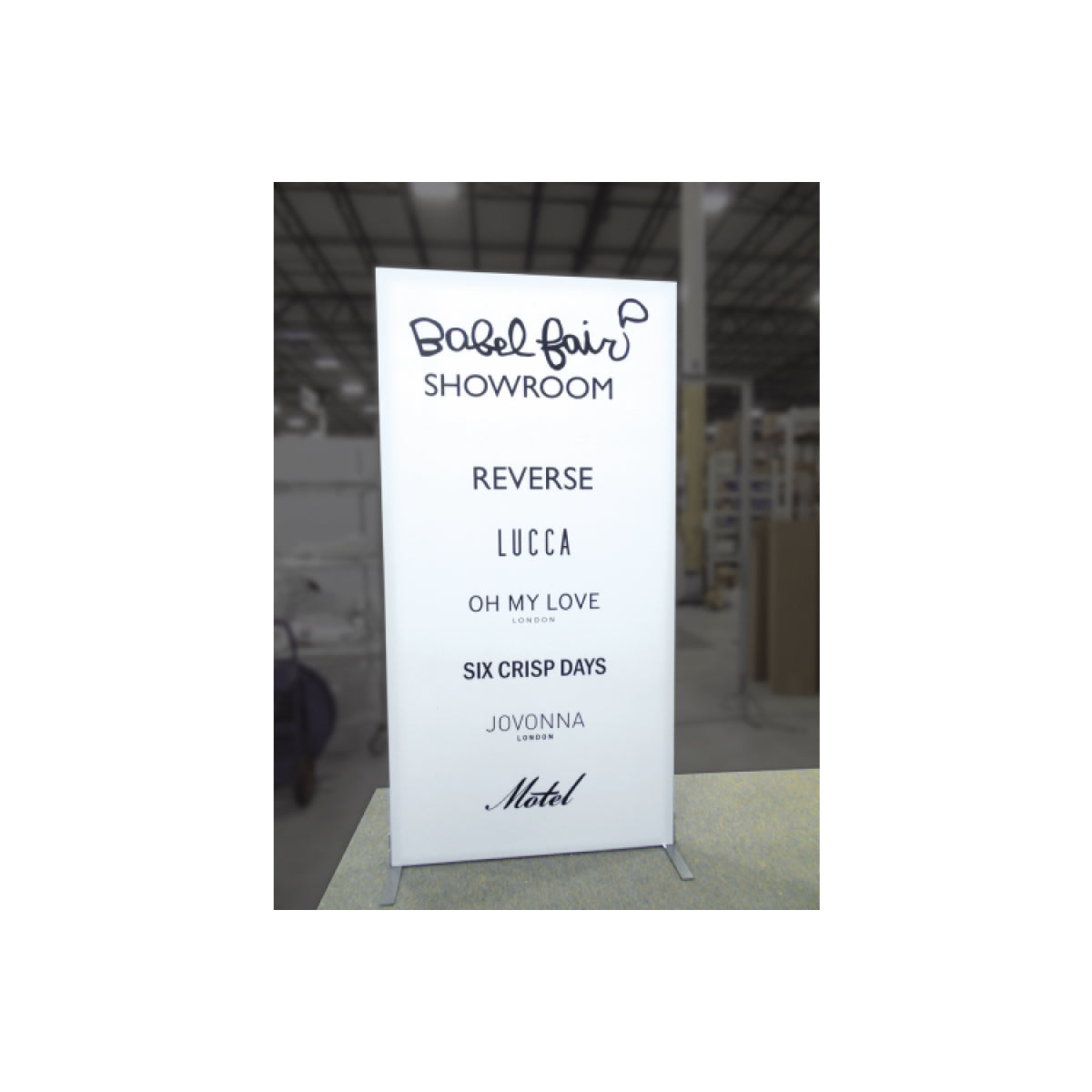 Freestanding trade show display board with multiple brand logos for exhibitions and special events