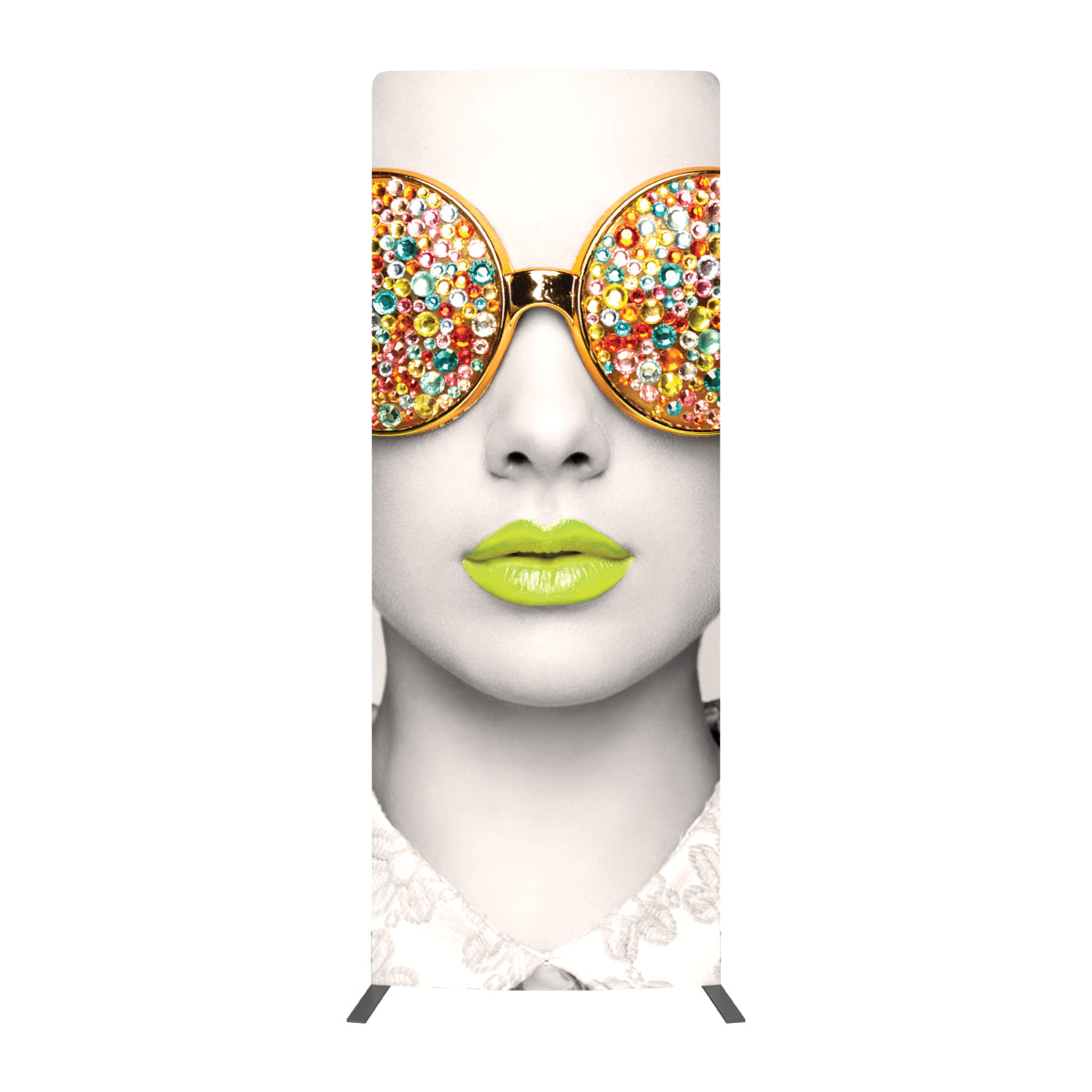 Tall exhibition banner featuring close-up of a face with large gem-studded round glasses and glossy lips
