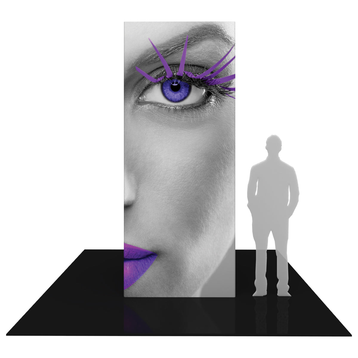 Tall rectangular trade show display tower featuring close-up image of a woman's face with detailed eye and lips, on exhibition floor