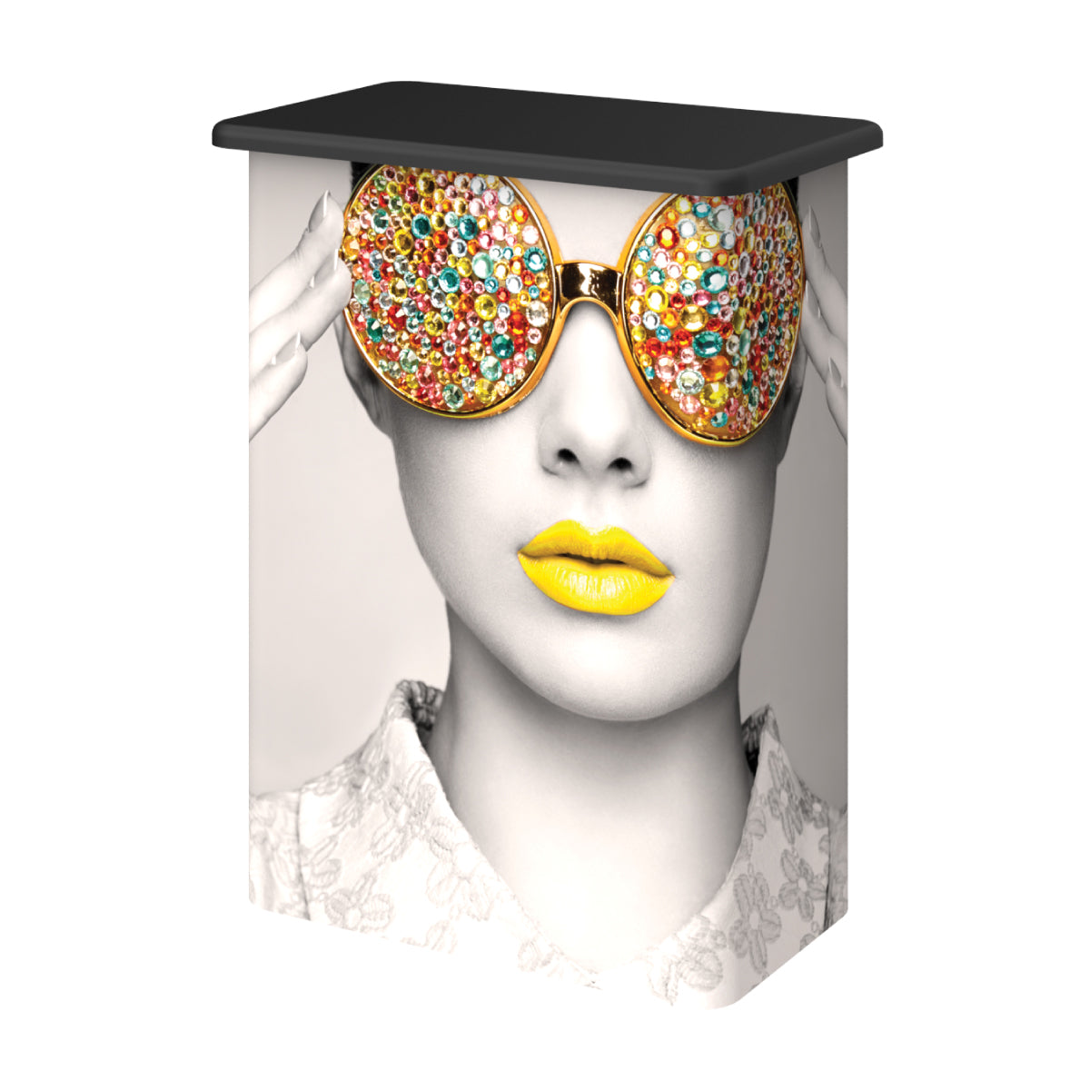 promotional trade show counter with graphic of woman wearing embellished sunglasses, vibrant lips