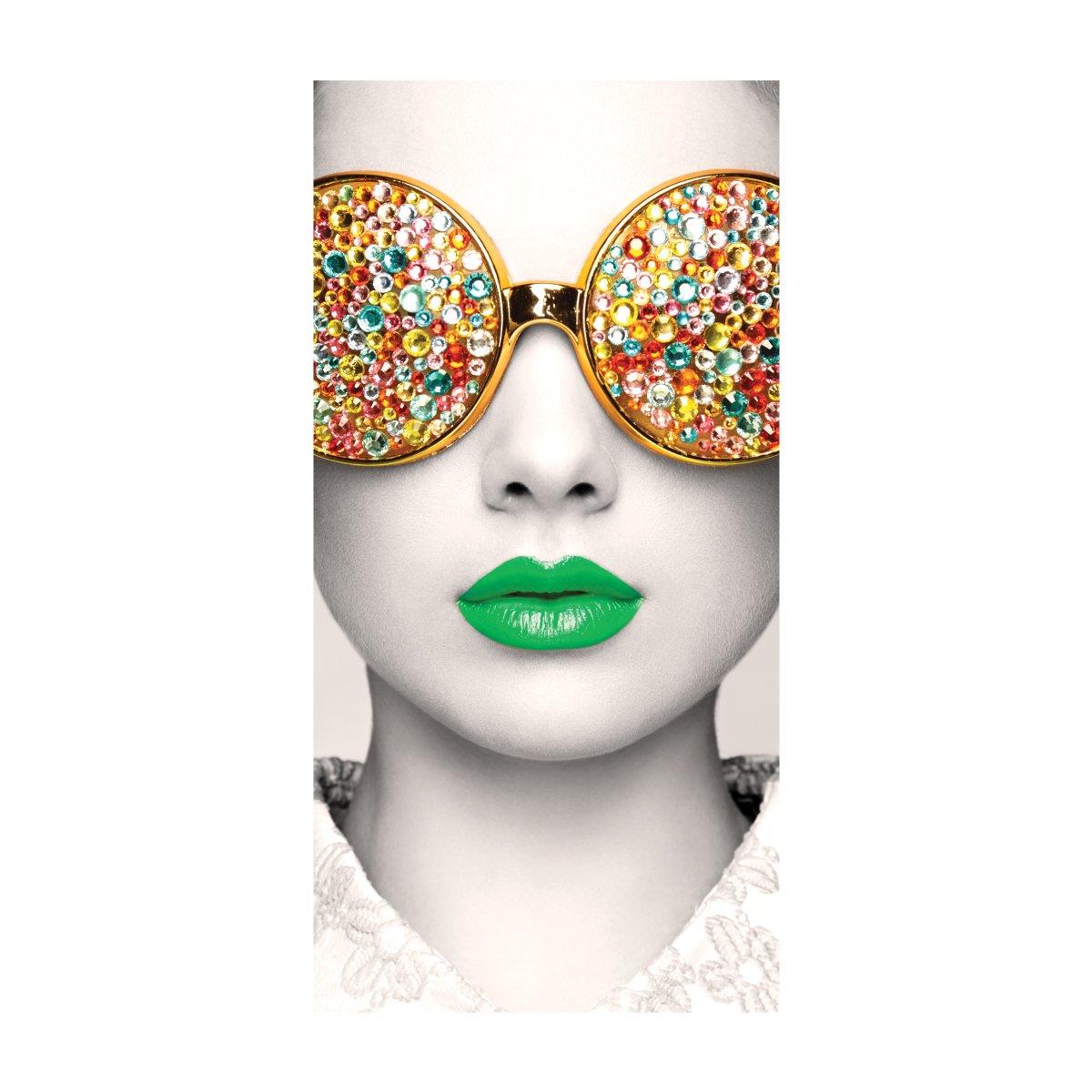 Graphic wall display featuring a stylized face with decorative sunglasses and vibrant green lips for trade shows