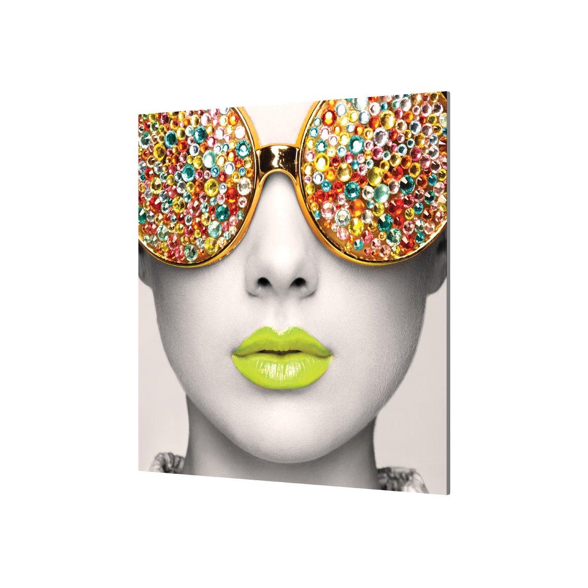 Close-up of wall display featuring artistic woman with embellished sunglasses and vibrant lips for trade shows