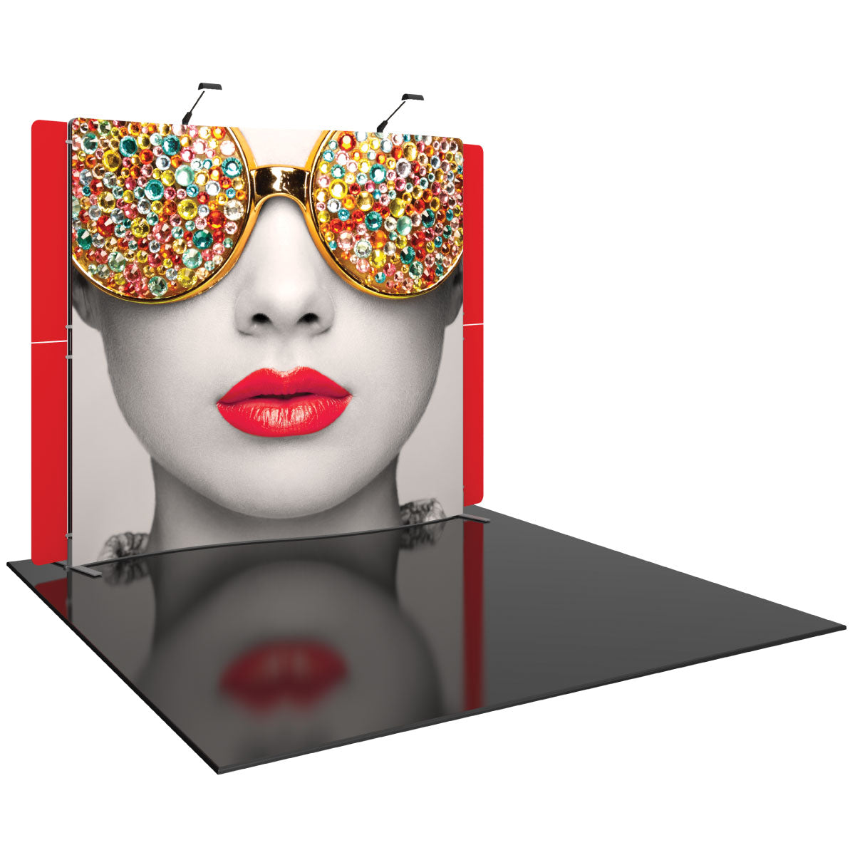 trade show display with large graphic of woman's face wearing jeweled sunglasses and bold lips