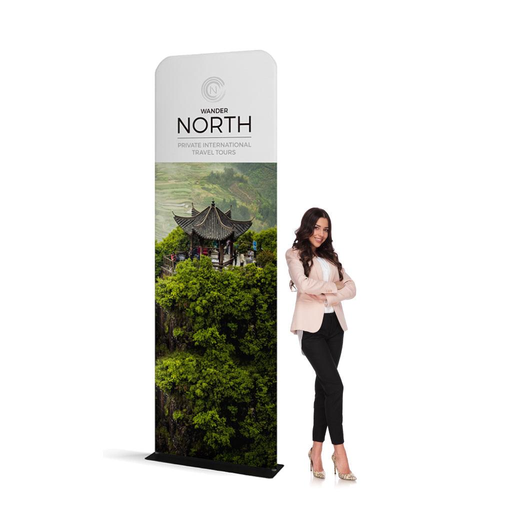 Tall waveline banner stand promoting private international travel tours at trade shows and exhibitions with woman beside it