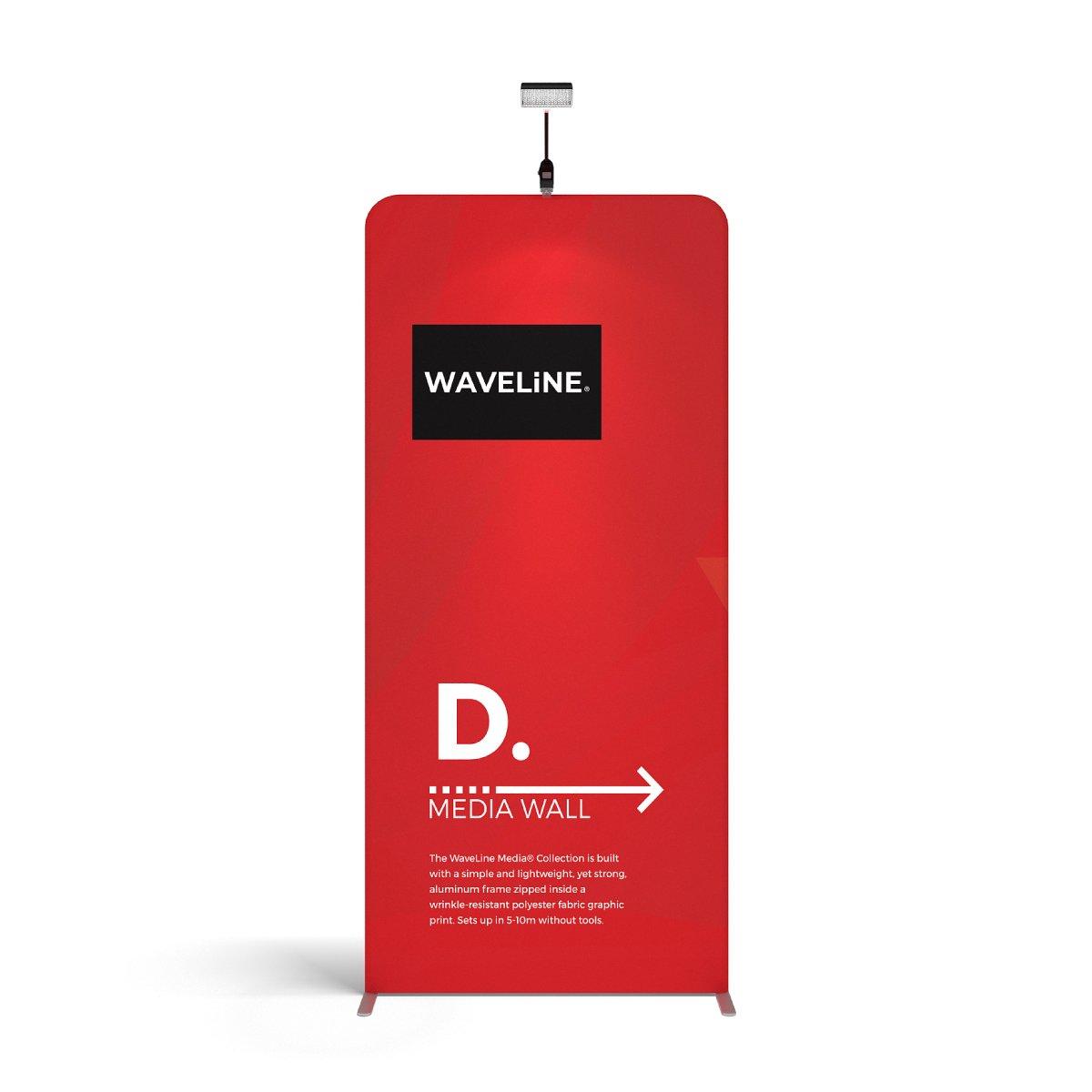 Trade show media wall display panel with branding and overhead spotlight for exhibitions