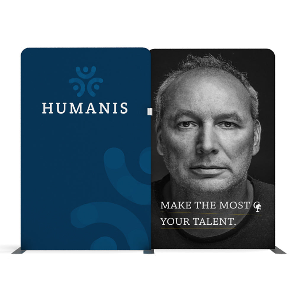 Two-panel trade show display with Humanis logo and motivational message beside a man's portrait for exhibitions