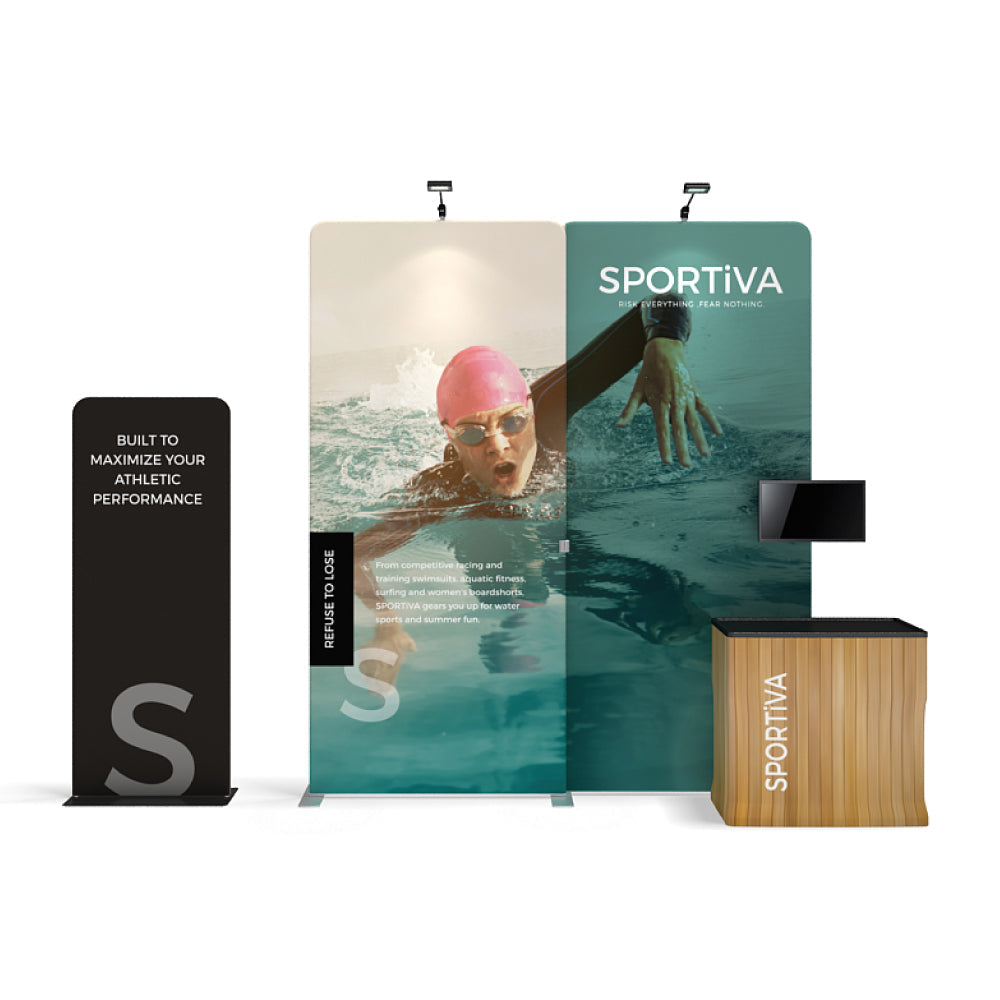 Trade show display with large printed graphics of swimmer, branding, brochure stand, and monitor for exhibitions