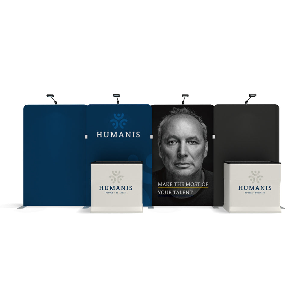 Trade show display with large branded backdrop panels and counters featuring human face and slogan for exhibitions