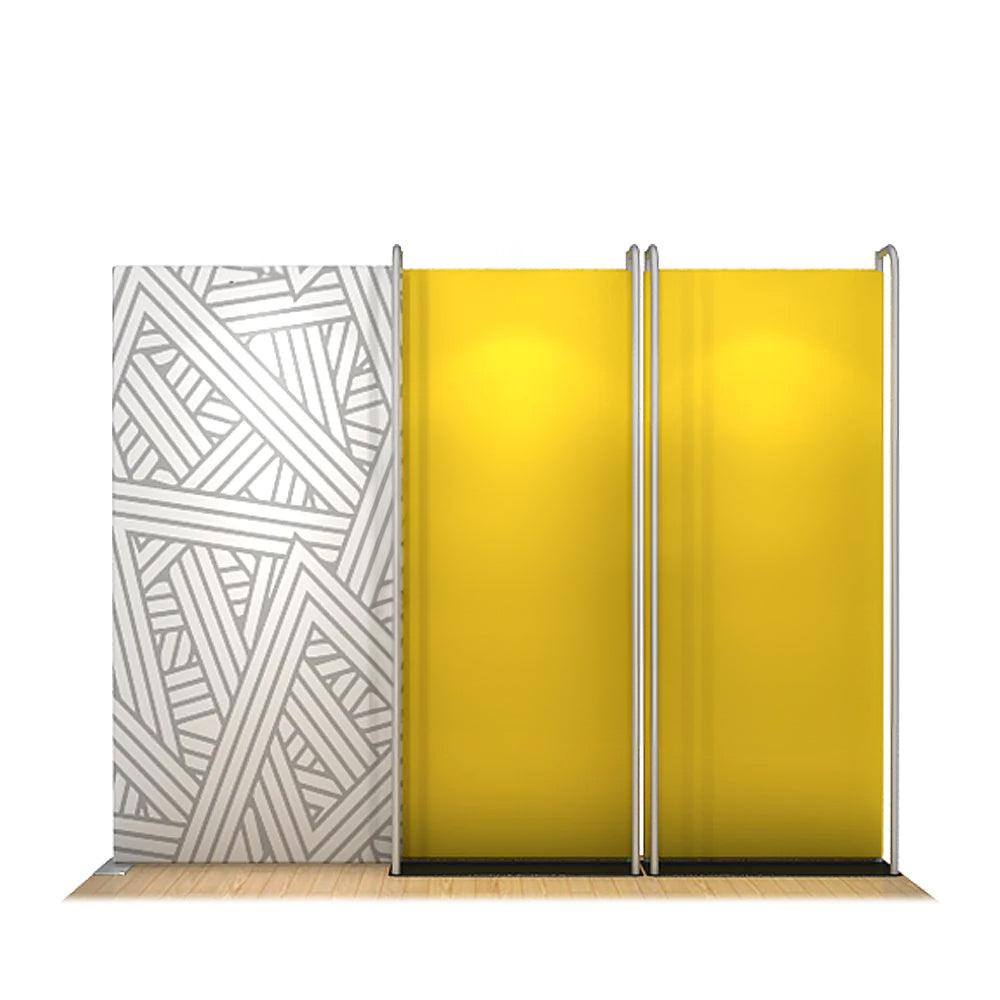 Compact trade show display kit with patterned backdrop and spotlighted panel stands for exhibitions