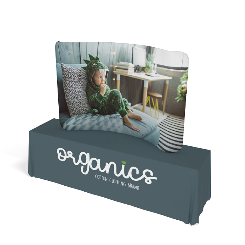 trade show curved tabletop display with child image and branded table cover for exhibitions