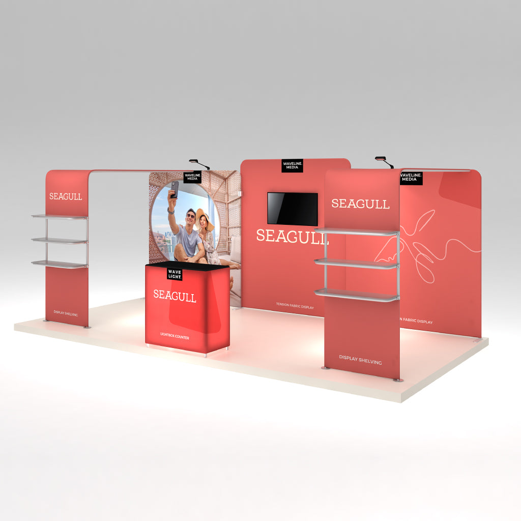 Trade show exhibit with tension fabric displays, lightbox counter, shelving units, and media screen for special events