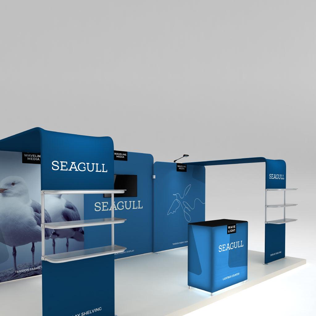 Modular trade show display with branded tension fabric panels, shelving units, and lightbox counter for exhibitions