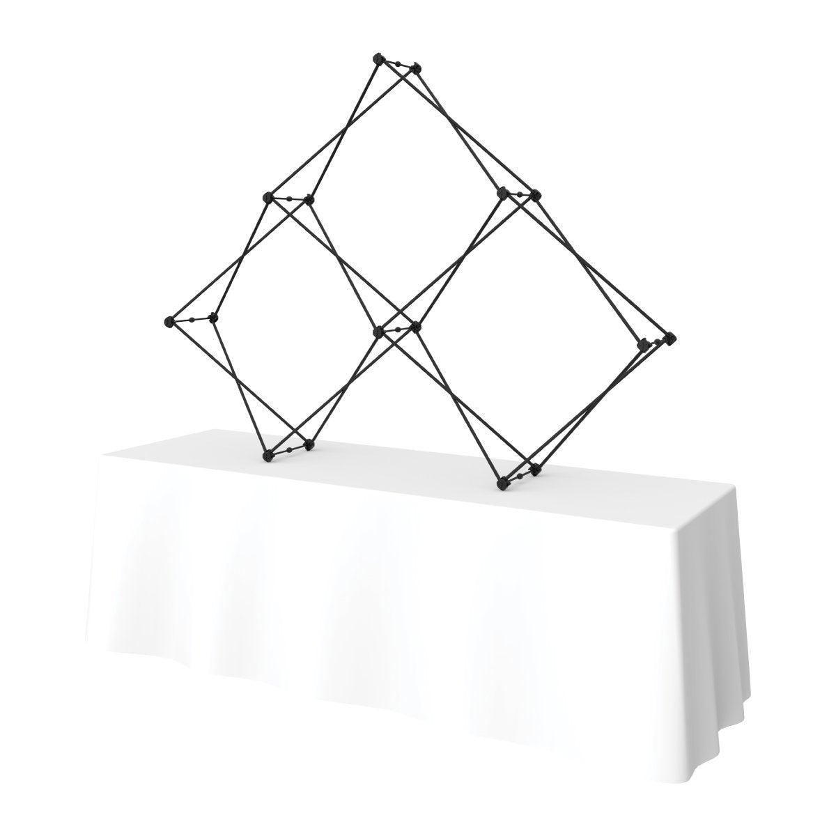 Expandable quad pyramid frame structure on a table for trade show and exhibition displays