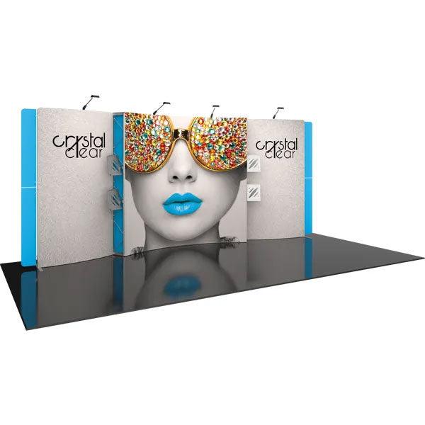 Trade show display featuring large graphic panels with artistic face and sunglasses design, spotlighting brand Crystal Clear