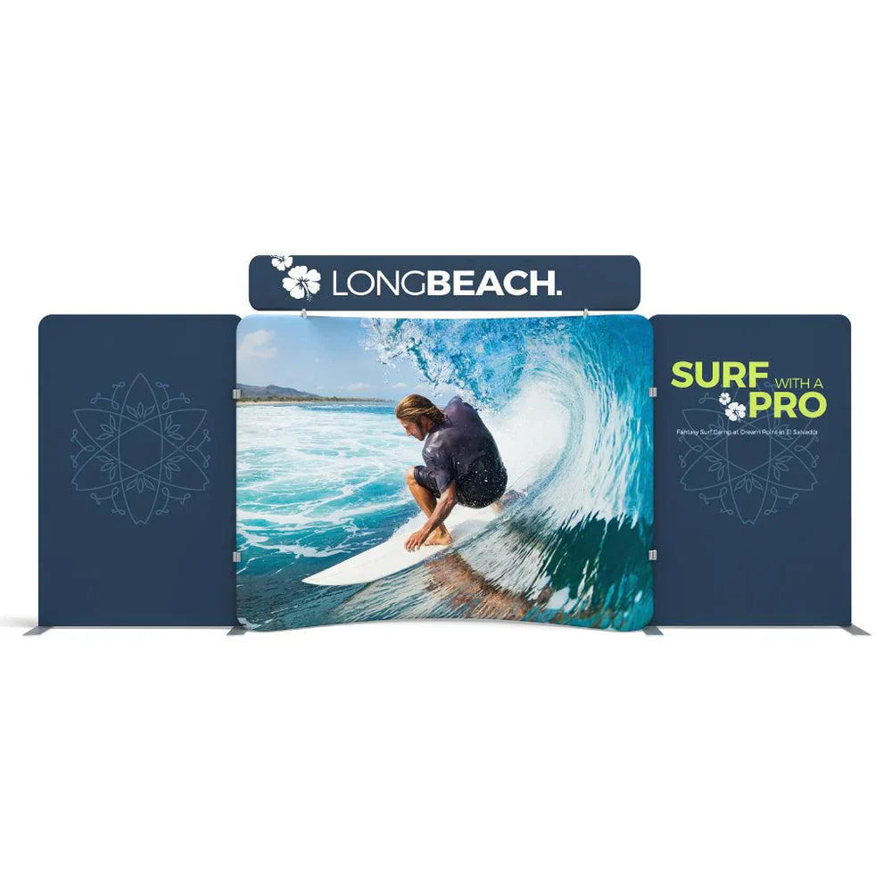 Trade show display with large graphic panels featuring surfing scene and promotional text for surfing events