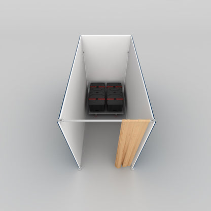 Trade show storage booth with walls, curtain entrance, and organized equipment containers inside