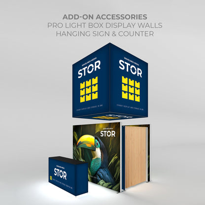 Trade show display setup with light box hanging sign, storage wall, and counter for exhibitions