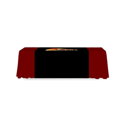 Trade show table with promotional full table runner featuring vibrant graphic for exhibitions and events